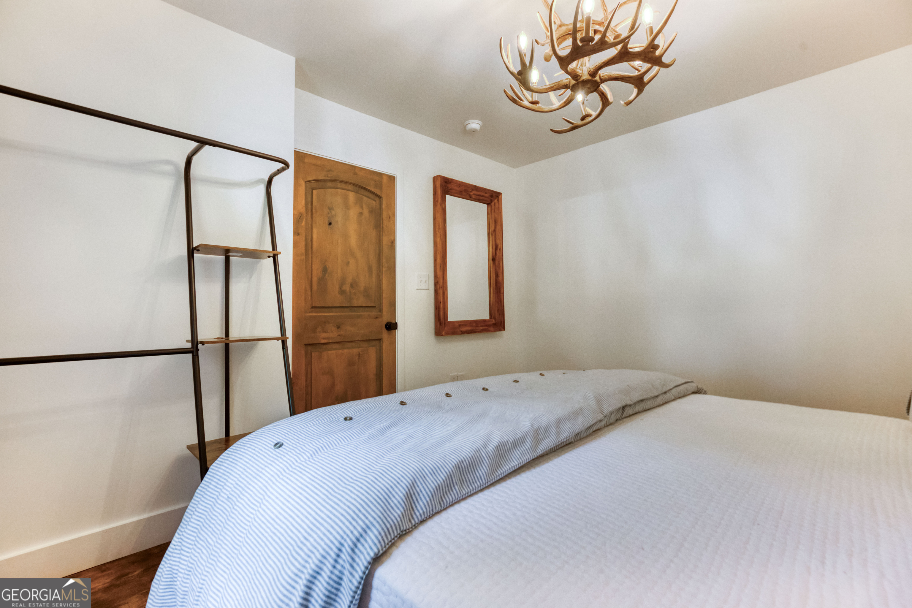 1968 Bobby Brown State Park Road Elberton, GA 30635 - Photo 86 of 97 a bedroom with a bed and a chandelier