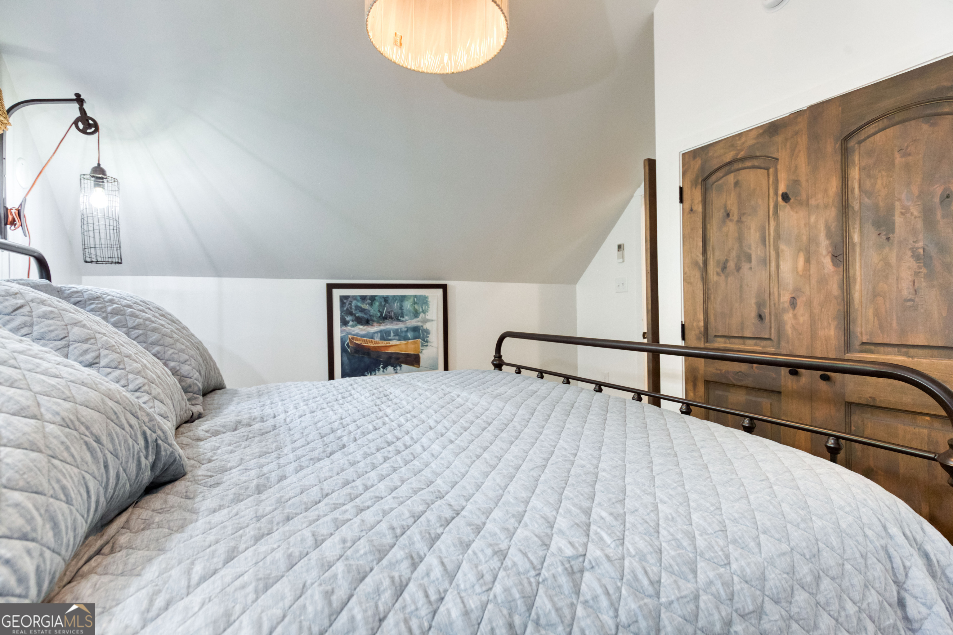 1968 Bobby Brown State Park Road Elberton, GA 30635 - Photo 91 of 97 a bedroom with a bed and wooden floor