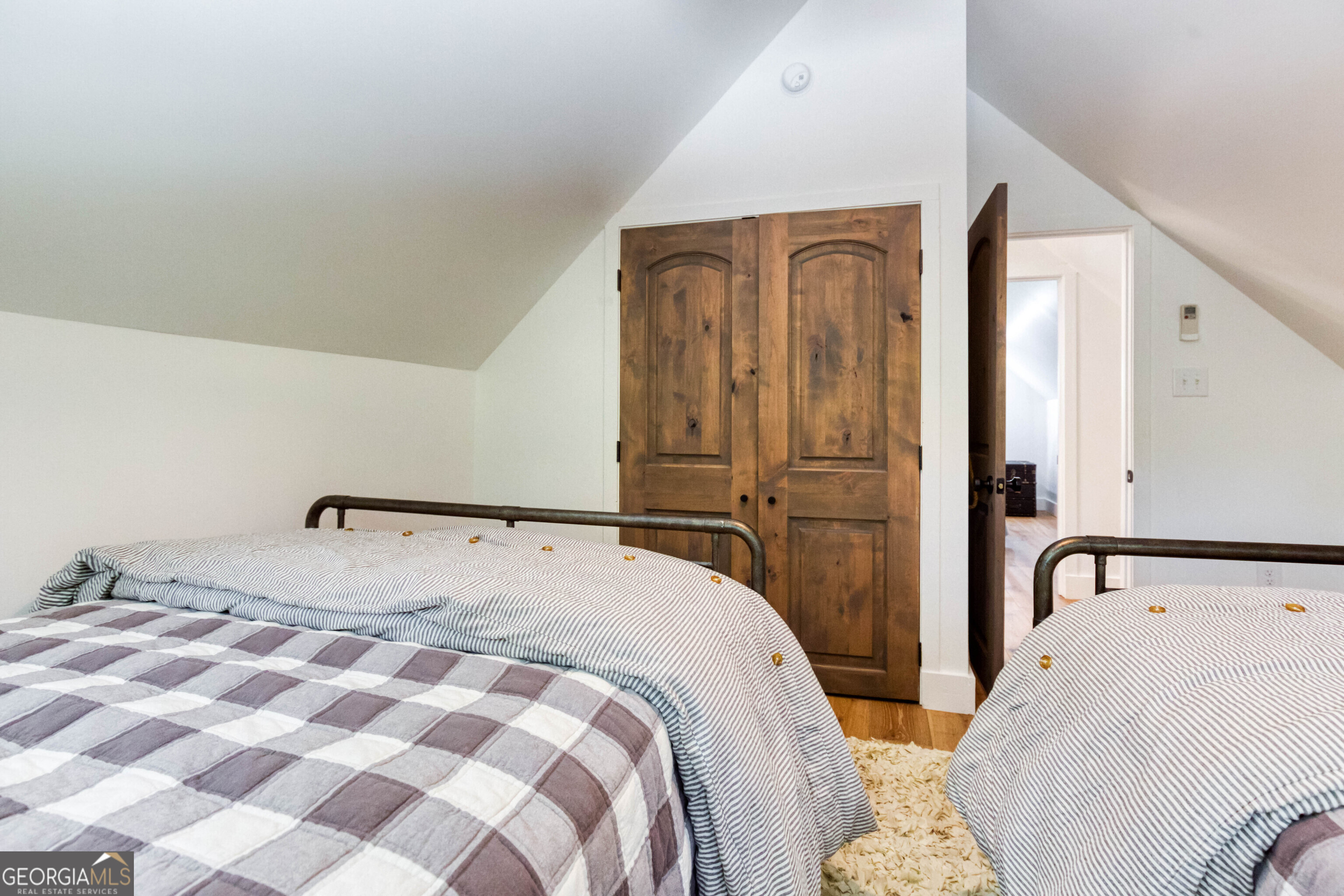 1968 Bobby Brown State Park Road Elberton, GA 30635 - Photo 93 of 97 a bedroom with a bed and dresser with wooden floor