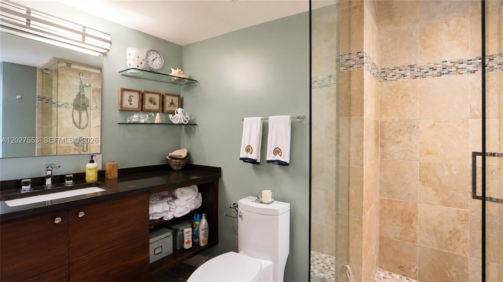 100 Lincoln Road, Unit 533 Miami Beach, FL 33139 - Photo 16 of 26 a bathroom with a granite countertop sink mirror vanity and toilet