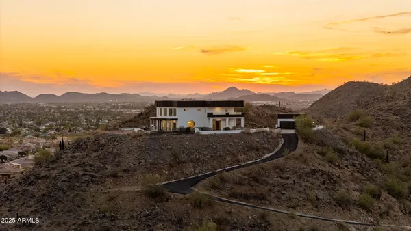 a view of a house with a mountain ground