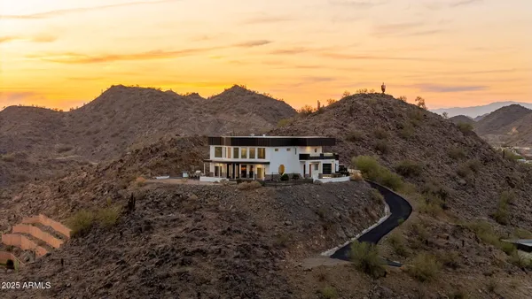 a view of a house with a mountain ground
