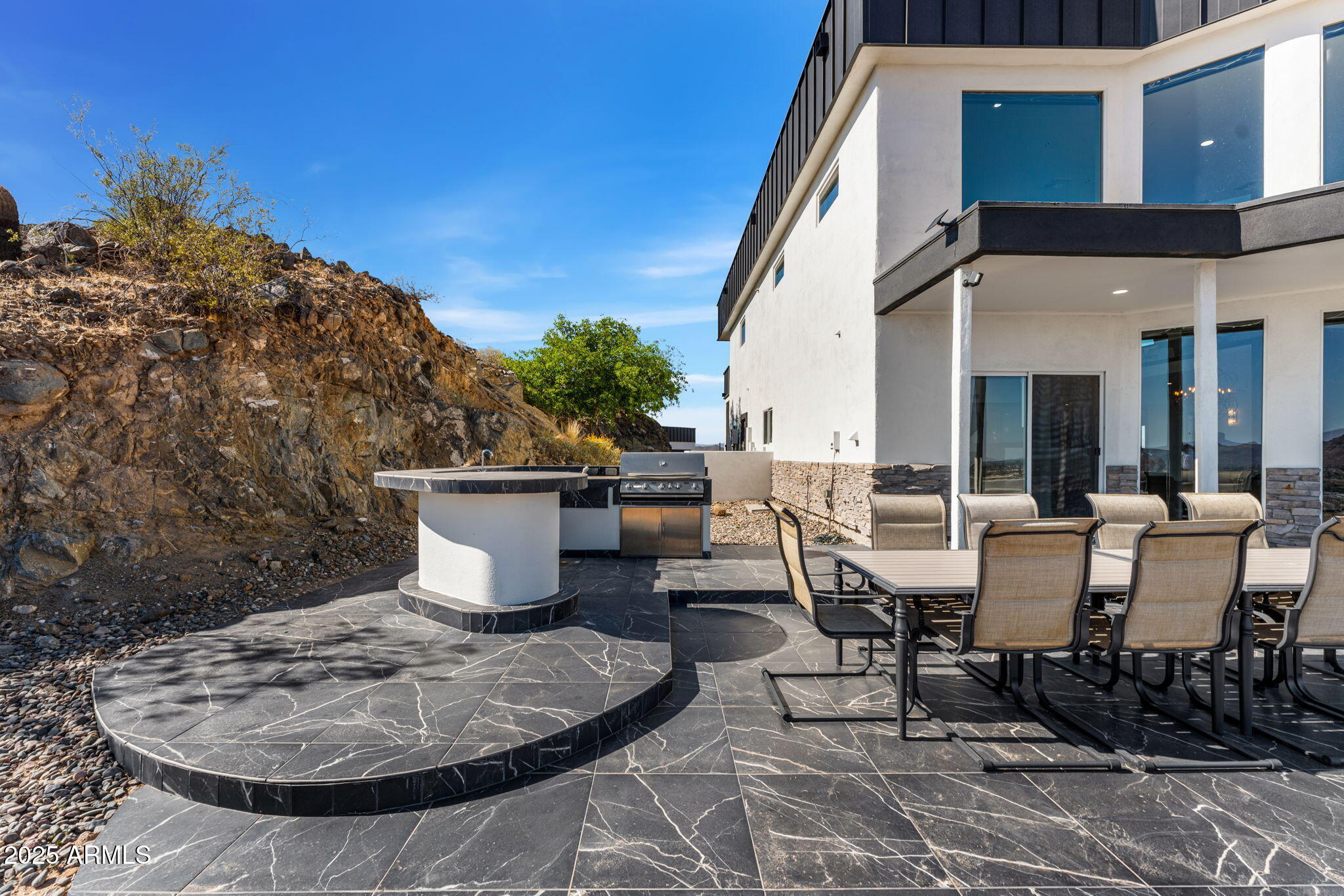 18812 North 22nd Street Phoenix, AZ 85024 - Photo 11 of 71 a view of a patio with table and chairs and potted plants