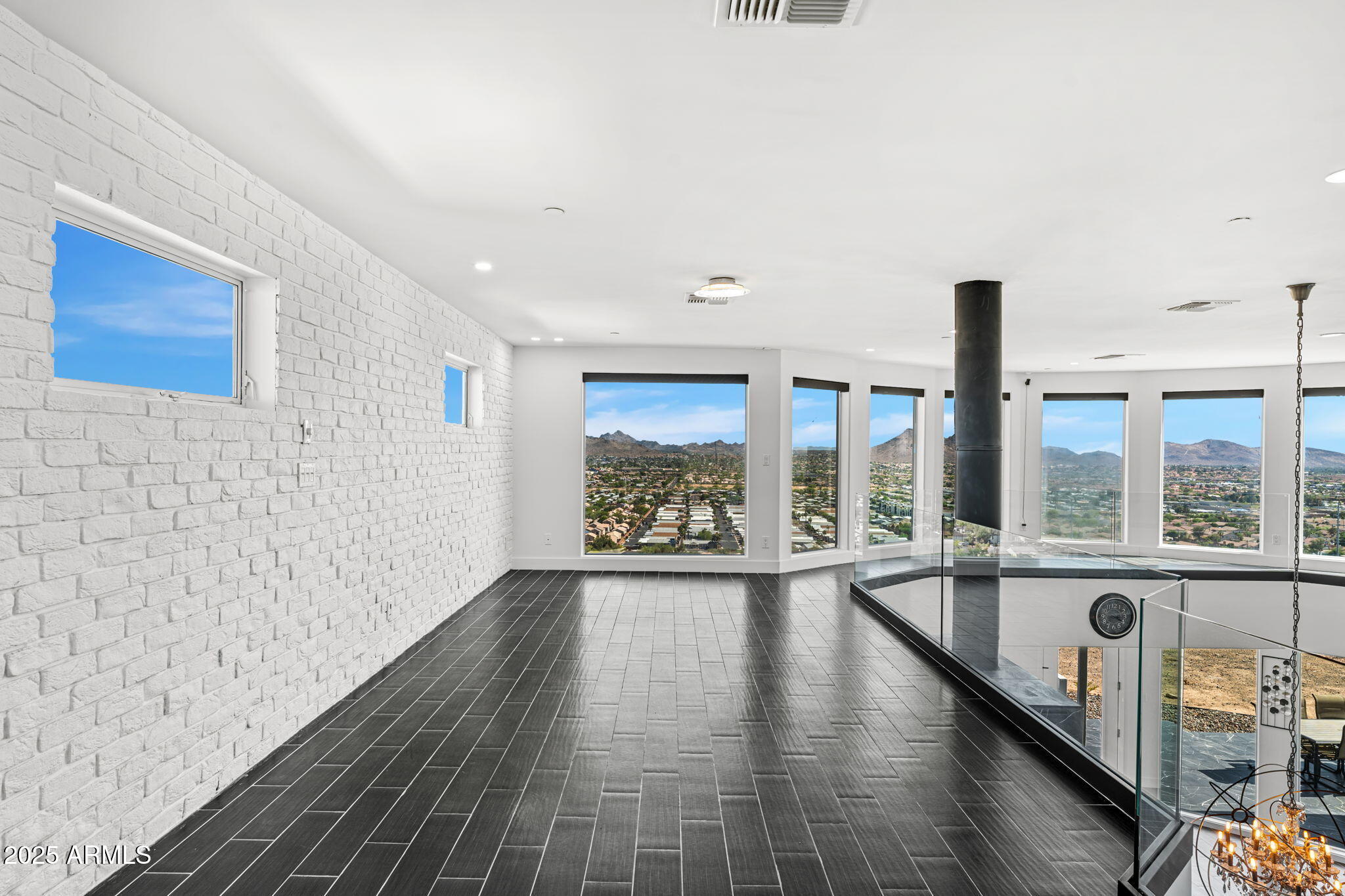 18812 North 22nd Street Phoenix, AZ 85024 - Photo 24 of 71 a view of an empty room with wooden floor and a window
