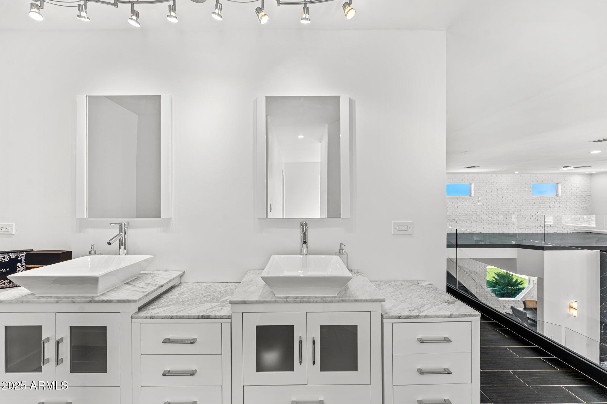 18812 North 22nd Street Phoenix, AZ 85024 - Photo 27 of 71 a bathroom with a sink and a mirror