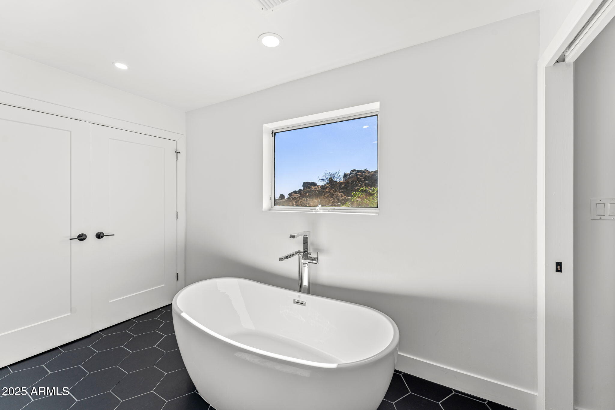 18812 North 22nd Street Phoenix, AZ 85024 - Photo 30 of 71 a bathroom with a sink and a mirror