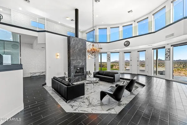 a kitchen with stainless steel appliances lots of counter top space and wooden floor
