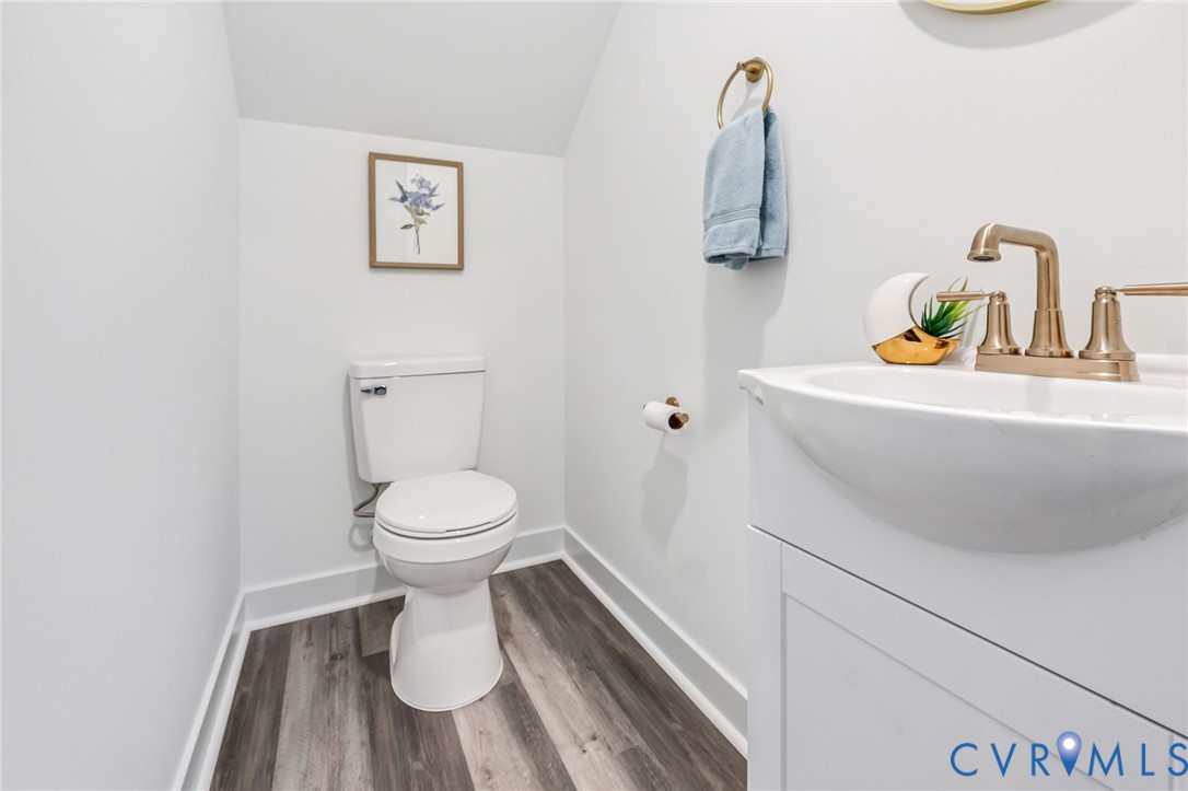 710 Harding Street Petersburg, VA 23803 - Photo 12 of 41 Half bath featuring vanity, dark wood-style floors