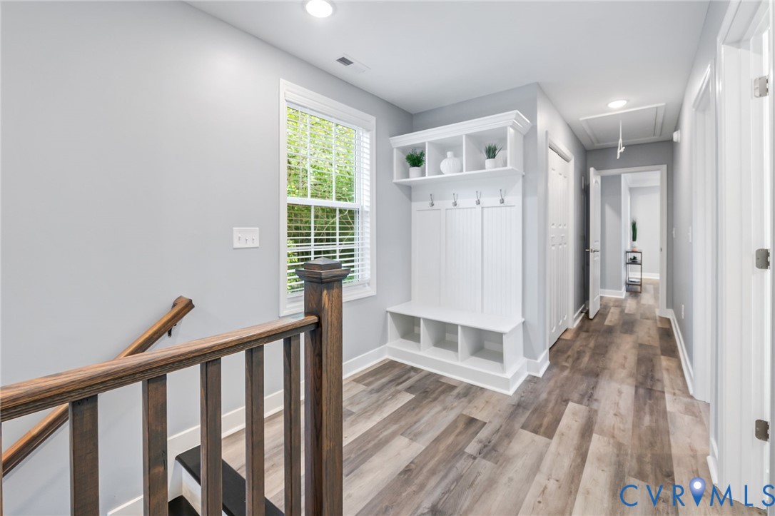 710 Harding Street Petersburg, VA 23803 - Photo 19 of 41 Mudroom with attic access, light wood-style floors