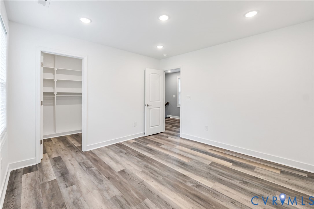 710 Harding Street Petersburg, VA 23803 - Photo 32 of 41 Unfurnished bedroom featuring a walk in closet, re