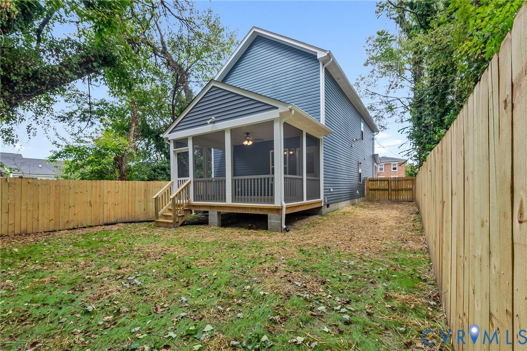 710 Harding Street Petersburg, VA 23803 - Photo 37 of 41 Back of property with a sunroom, a fenced backyard