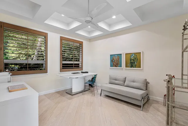 a view of a swimming pool with lounge chairs