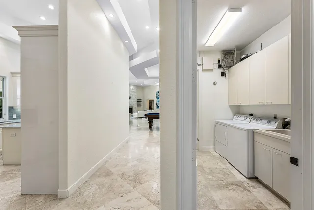 a front view of a house with a yard and a garage