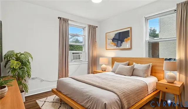 a bedroom with a bed window and glass door
