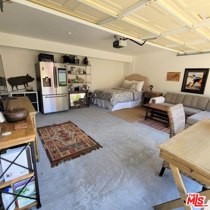 110 Canada Street Ojai, CA 93023 - Photo 26 of 36 a bedroom with furniture and a book shelf