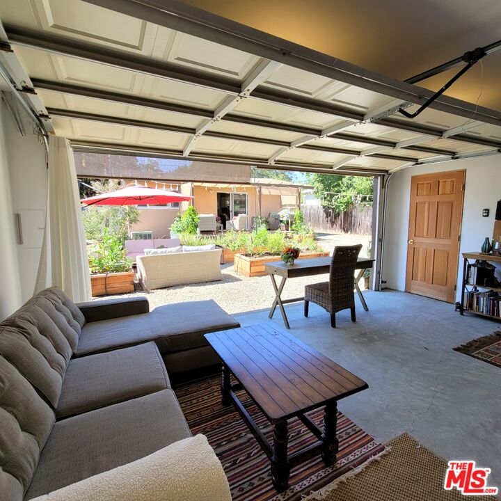 110 Canada Street Ojai, CA 93023 - Photo 28 of 36 a living room with furniture a table and a large window