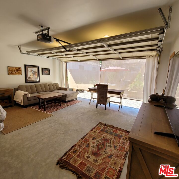 110 Canada Street Ojai, CA 93023 - Photo 29 of 36 a living room with furniture a rug and a window