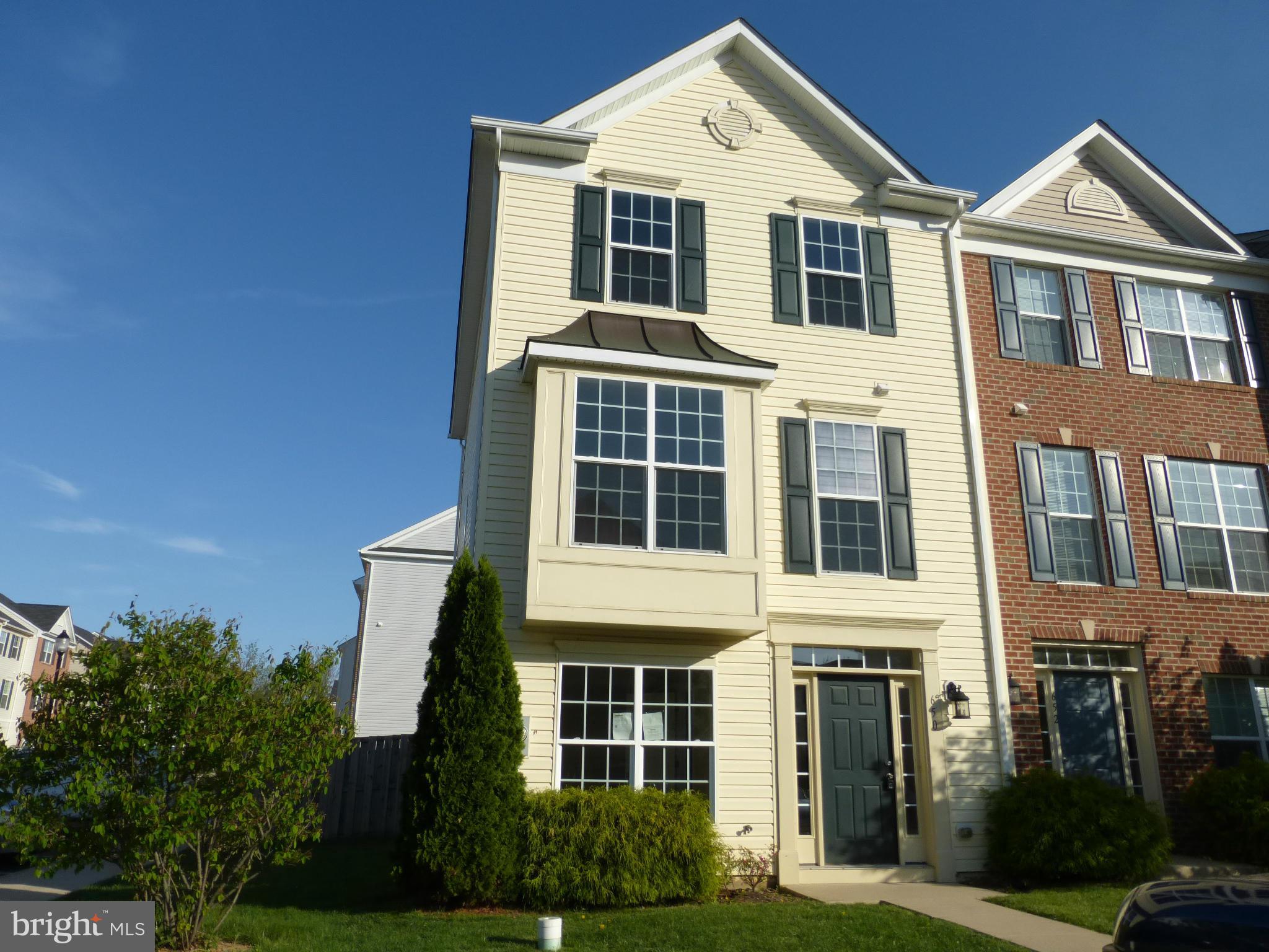 650 Wild Hunt Road Frederick, MD 21703 - Photo 1 of 14 a front view of a house with a yard