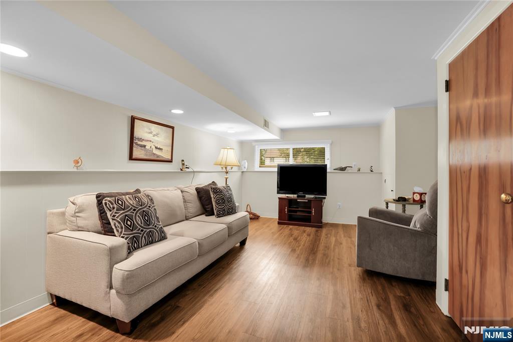 23 Ridge Court Cedar Grove, NJ 07009 - Photo 26 of 37 a living room with furniture and a flat screen tv