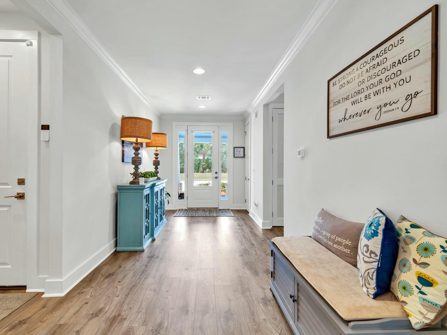 176 Hibernate Way Freeport, FL 32439 - Photo 11 of 66 a view of a hallway with wooden floor and furniture