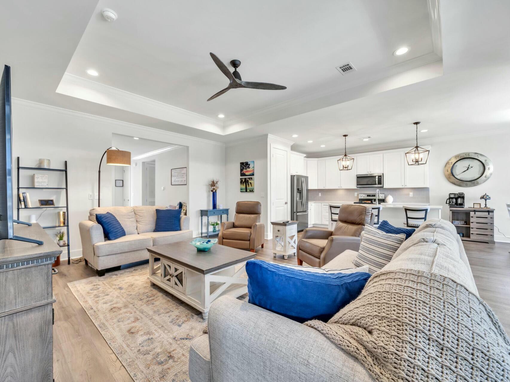 176 Hibernate Way Freeport, FL 32439 - Photo 15 of 66 a living room with furniture kitchen view and a chandelier