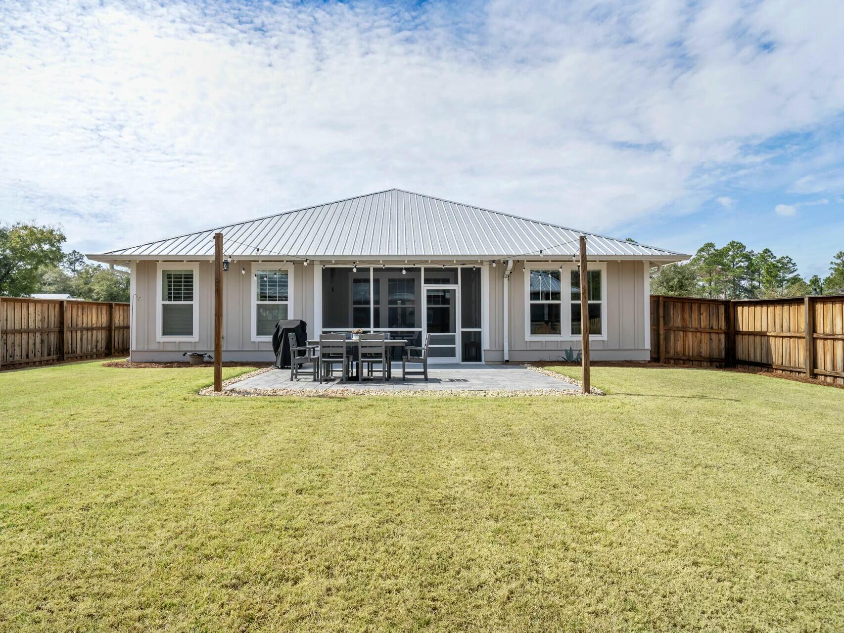 176 Hibernate Way Freeport, FL 32439 - Photo 25 of 66 a swimming pool with outdoor seating and yard