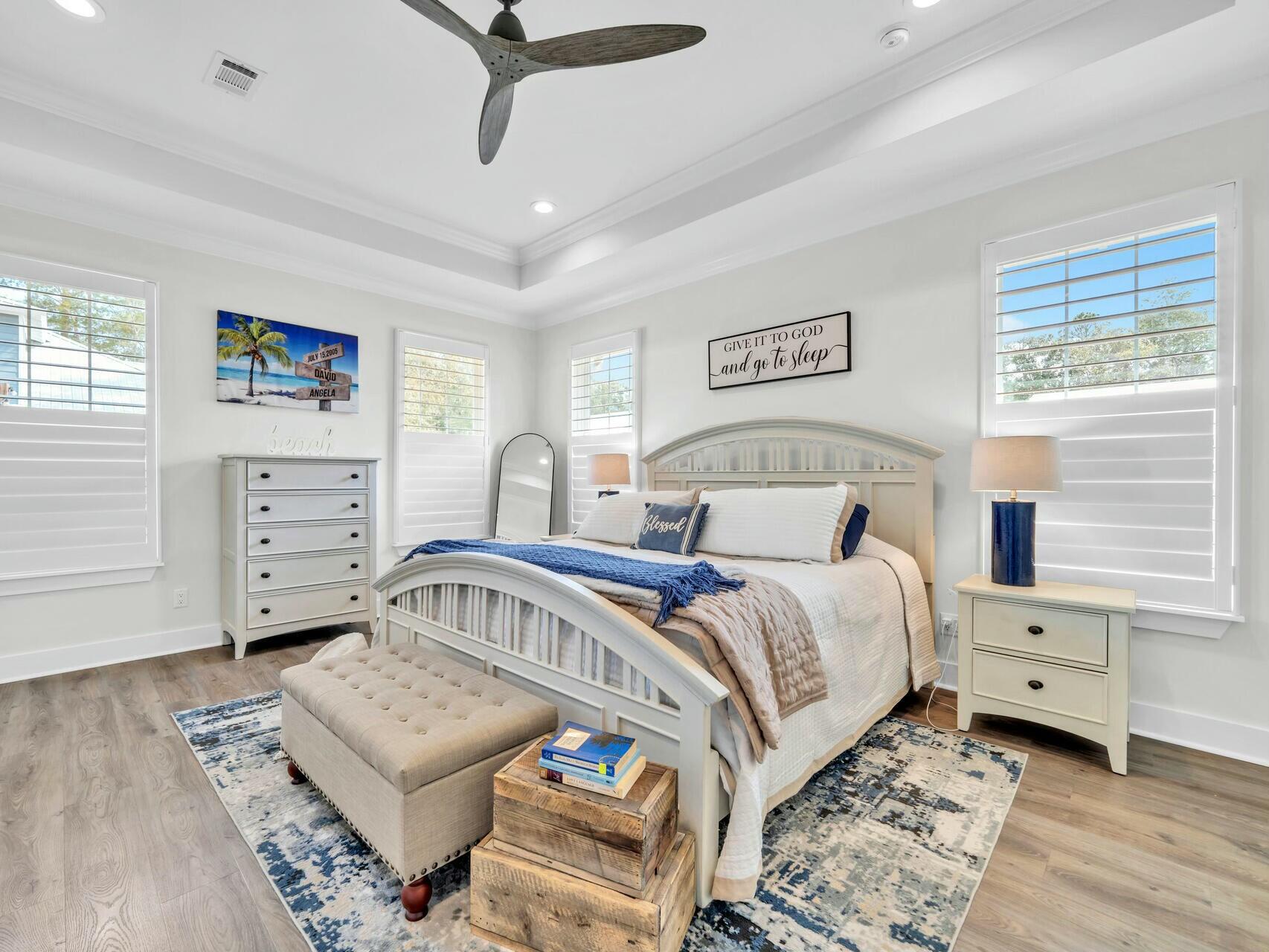 176 Hibernate Way Freeport, FL 32439 - Photo 32 of 66 a bedroom with a bed a couch and a window