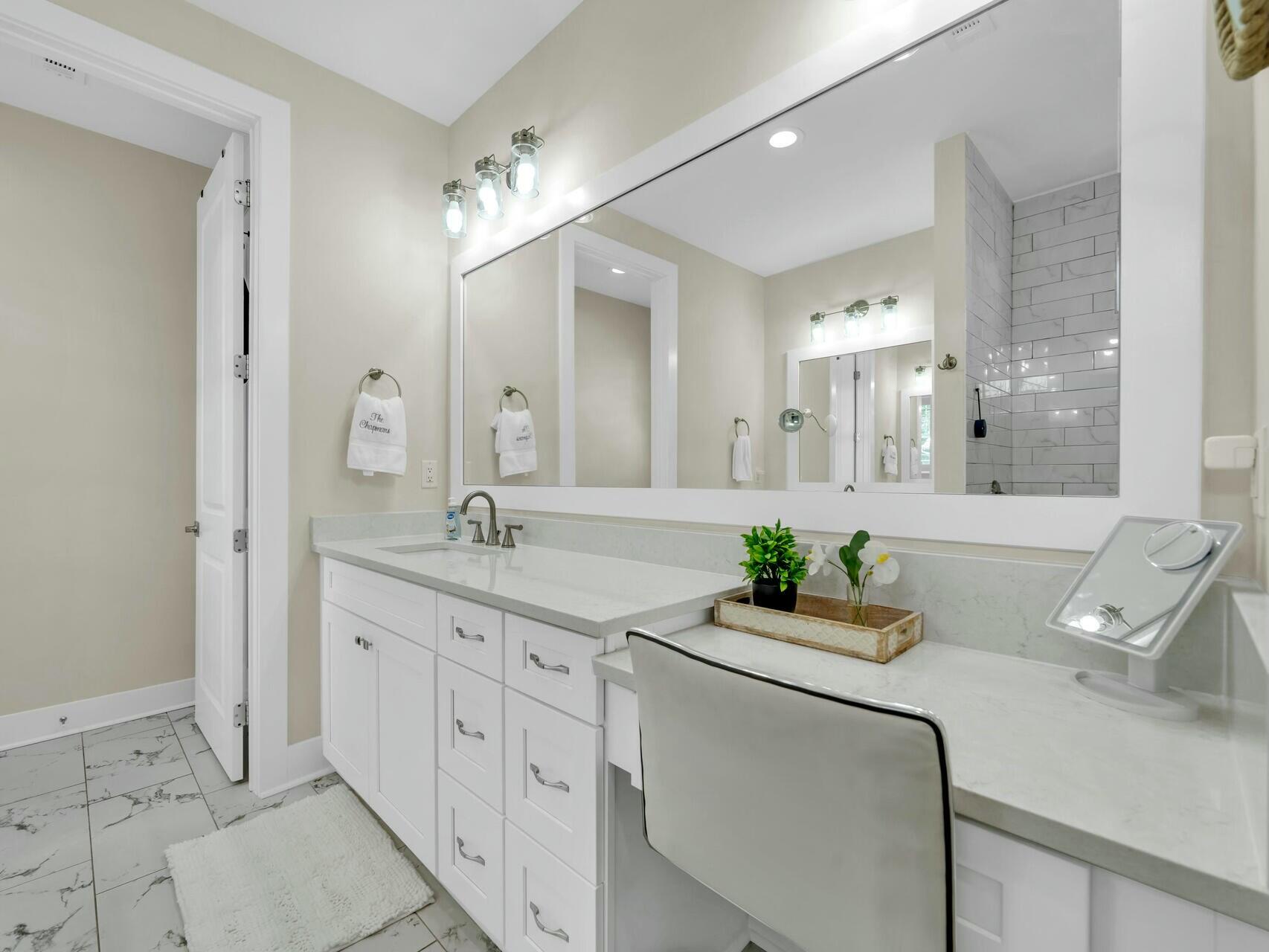 176 Hibernate Way Freeport, FL 32439 - Photo 35 of 66 a bathroom with a sink double vanity and a mirror