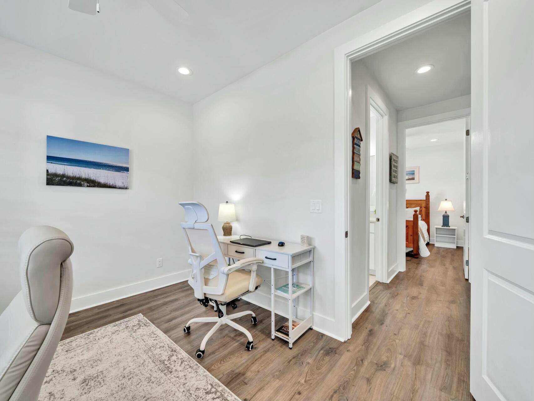 176 Hibernate Way Freeport, FL 32439 - Photo 40 of 66 a view of a workspace with furniture and wooden floor