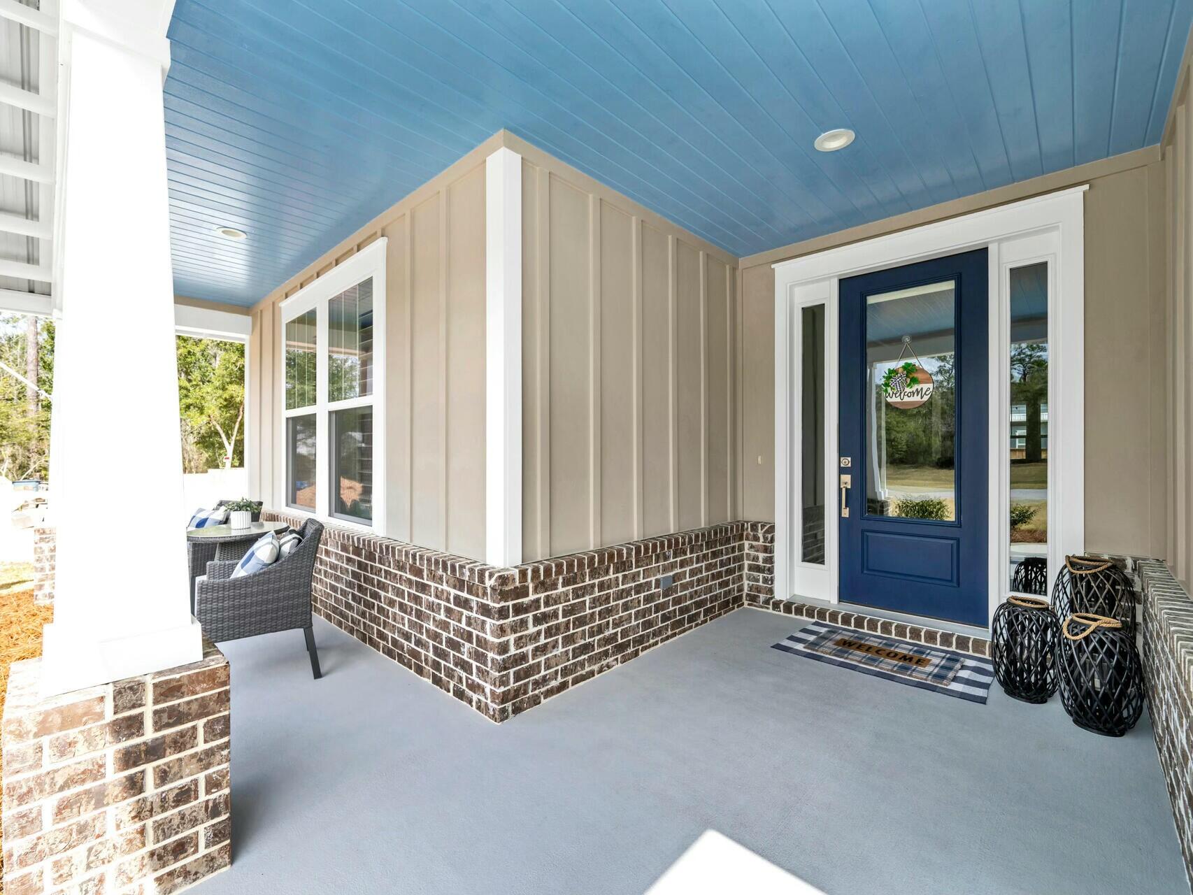 176 Hibernate Way Freeport, FL 32439 - Photo 10 of 66 a living room with furniture and large windows