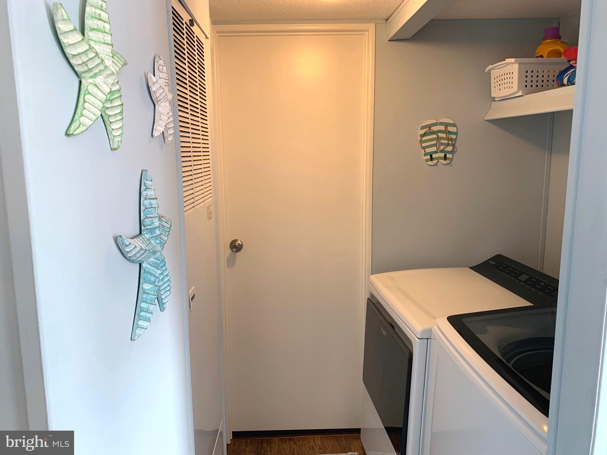 21229 M Street Rehoboth Beach, DE 19971 - Photo 13 of 23 a utility room with dryer and washer