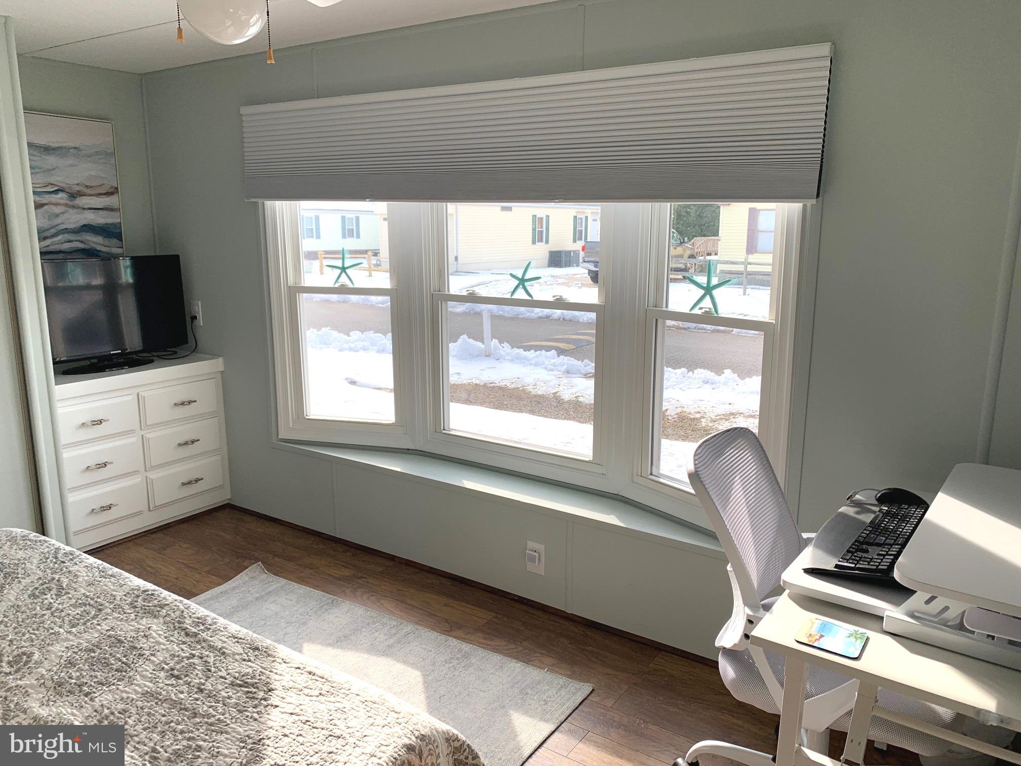 21229 M Street Rehoboth Beach, DE 19971 - Photo 16 of 23 a view of a living room and dining room