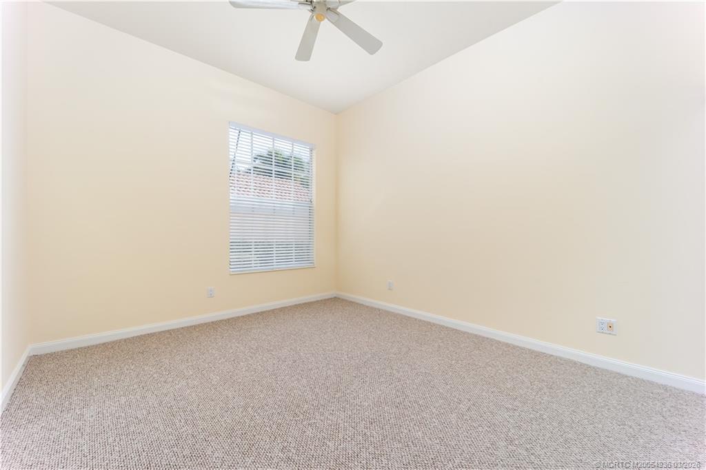 1477 Southwest Eagleglen Place Stuart, FL 34997 - Photo 24 of 36 a view of an empty room with a window