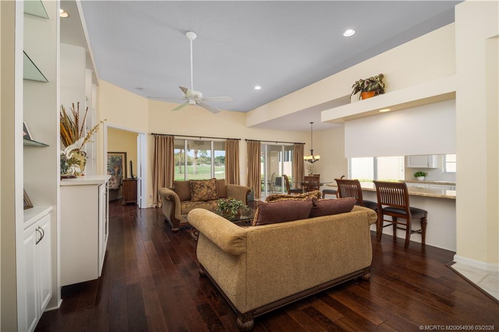 1477 Southwest Eagleglen Place Stuart, FL 34997 - Photo 5 of 36 a living room with furniture and wooden floor