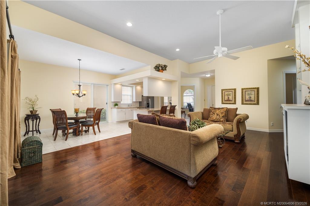 1477 Southwest Eagleglen Place Stuart, FL 34997 - Photo 6 of 36 a living room with furniture and wooden floor
