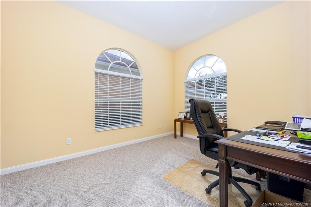 1477 Southwest Eagleglen Place Stuart, FL 34997 - Photo 10 of 36 a workspace with furniture and a window