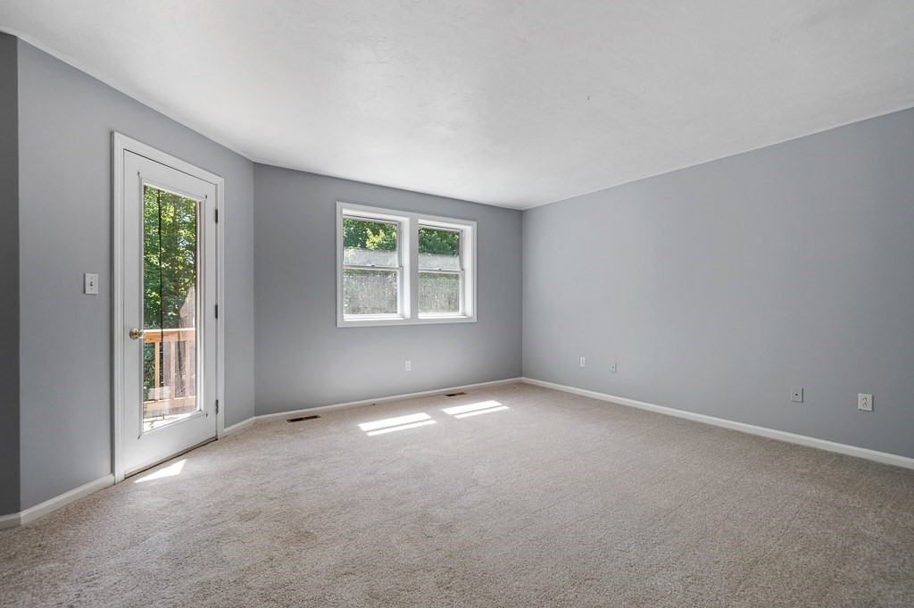 22 Highfield Road, Unit A Charlton, MA 01507 - Photo 11 of 26 an empty room with windows
