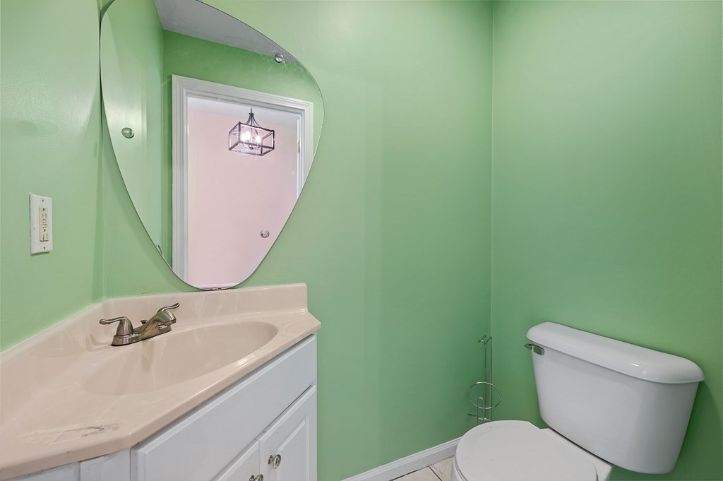 22 Highfield Road, Unit A Charlton, MA 01507 - Photo 17 of 26 a bathroom with a toilet sink and mirror