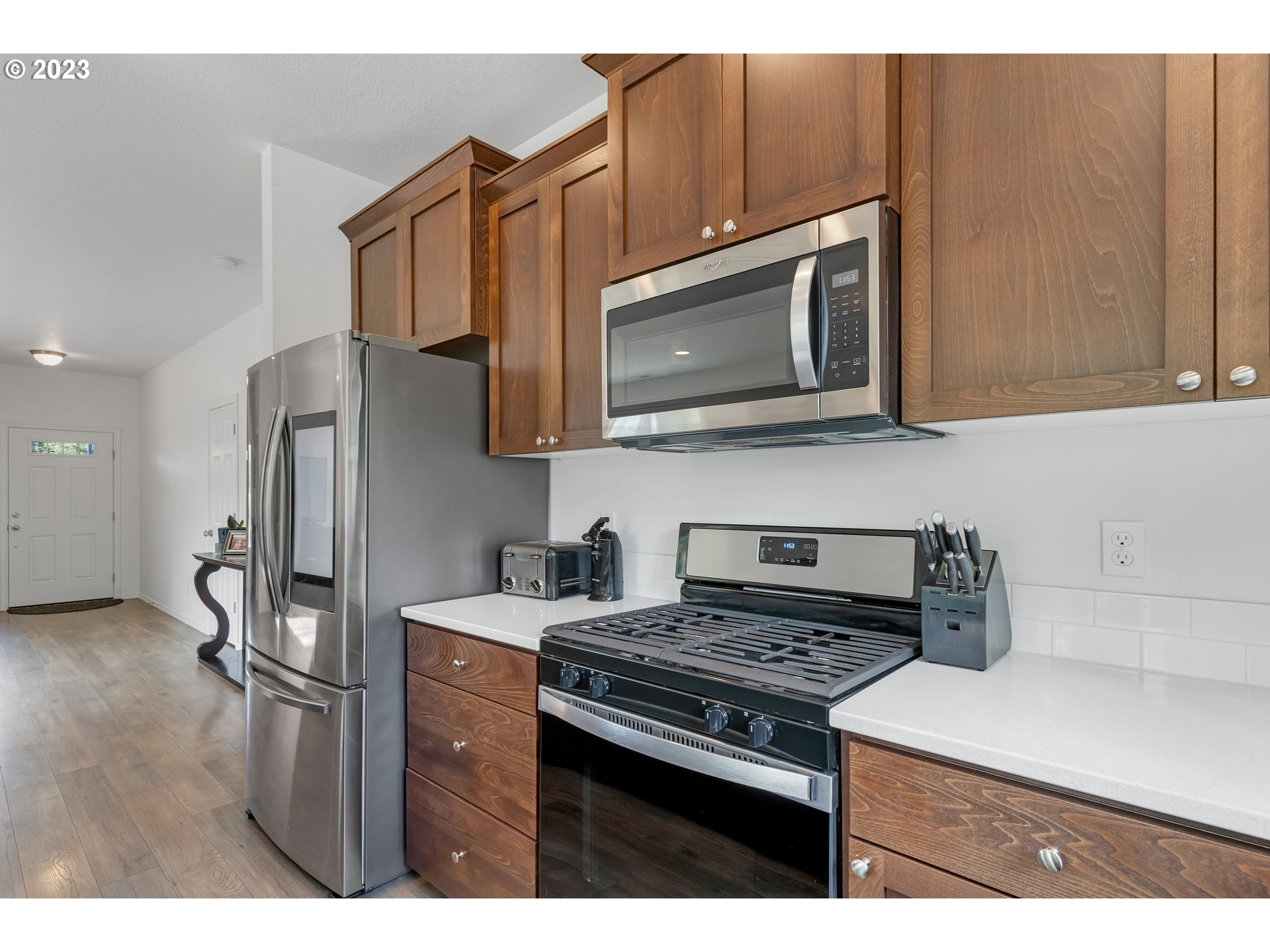 32580 South Needy Road Canby, OR 97013 - Photo 15 of 35 a kitchen with stainless steel appliances granite countertop a stove microwave and sink