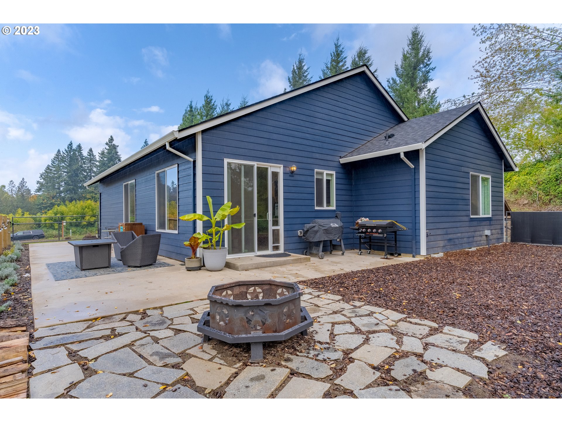 32580 South Needy Road Canby, OR 97013 - Photo 32 of 35 a view of a house with backyard and sitting area