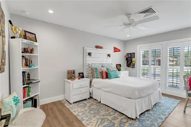 a bedroom with a bed and a book shelf