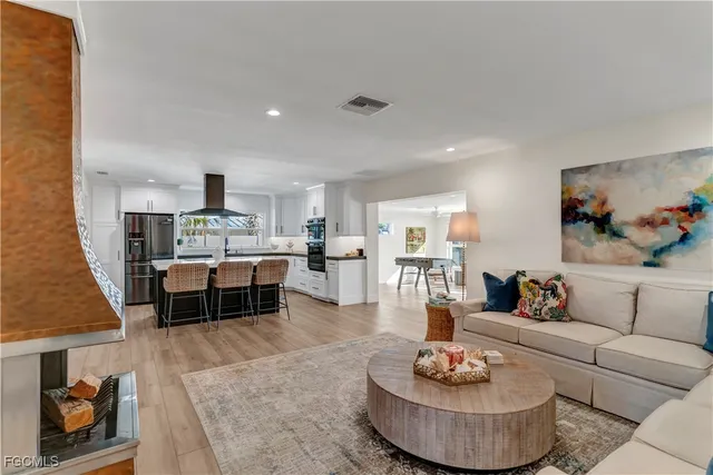 a living room with furniture and a rug