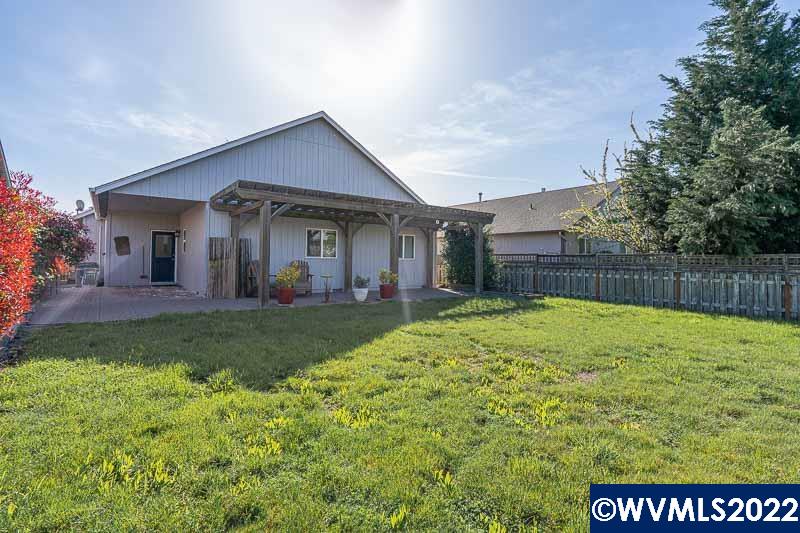 1569 Briar Road Independence, OR 97351 - Photo 22 of 24 a view of a house with a yard and a garden