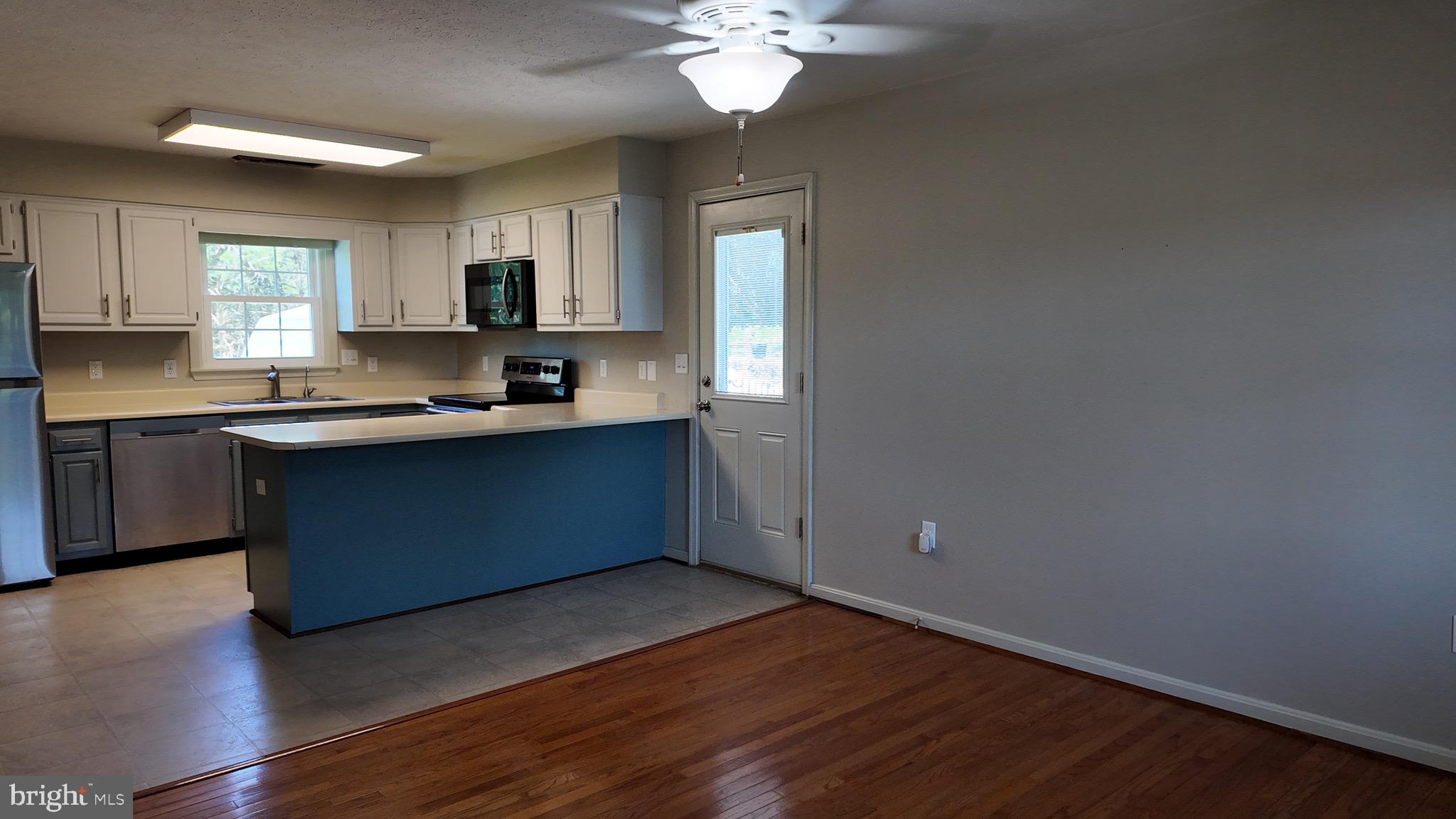 1185 Kesler Road Front Royal, VA 22630 - Photo 20 of 51 a kitchen with a sink cabinets and wooden floor