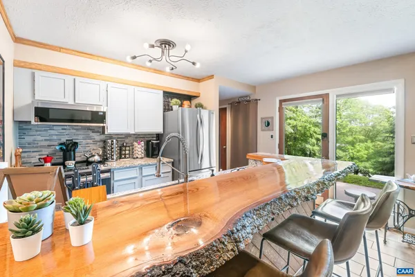 a very nice looking dining room with a large window