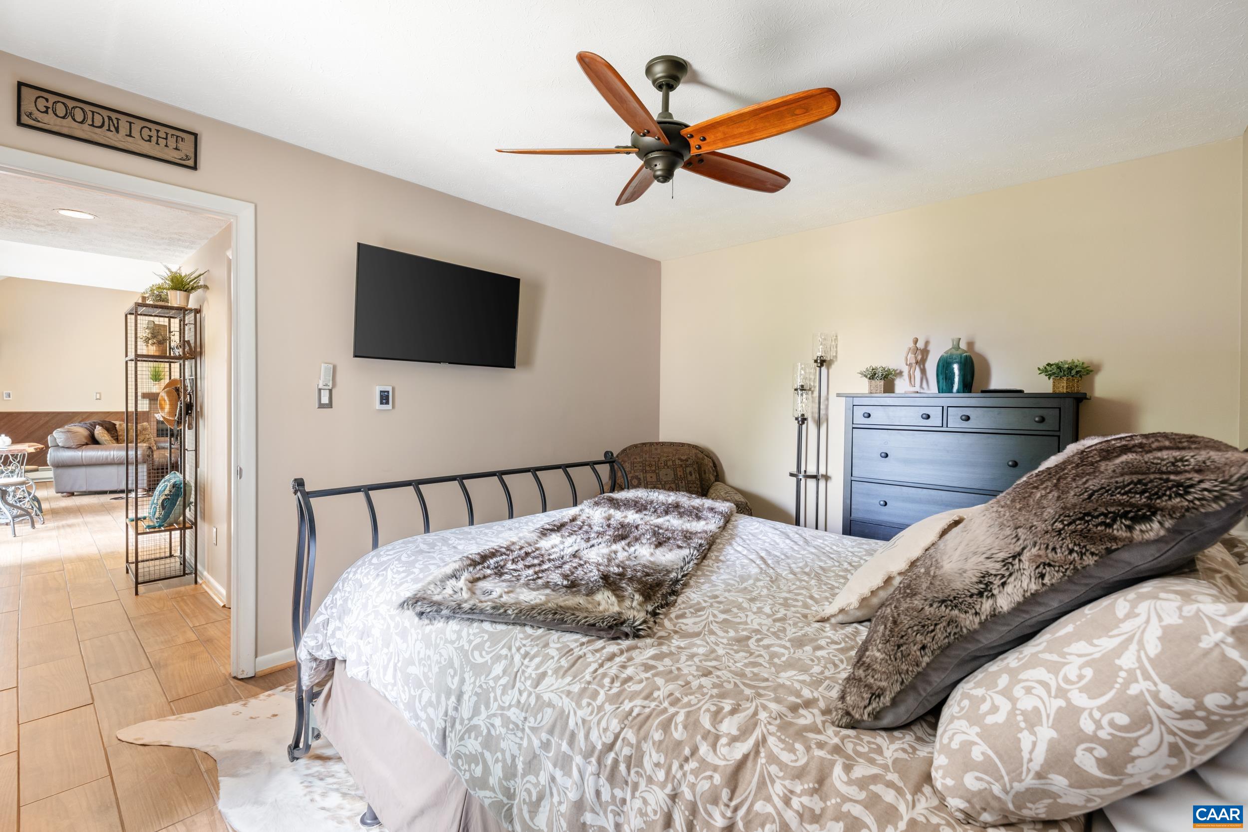 2225 Tanners Ridge Roseland, VA 22967 - Photo 14 of 26 a bedroom with a bed and a flat screen tv