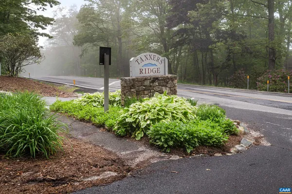 a sign that is next to a road