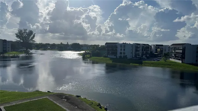 a view of a lake in between two chairs
