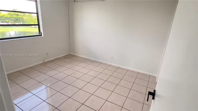 a view of an empty room and window