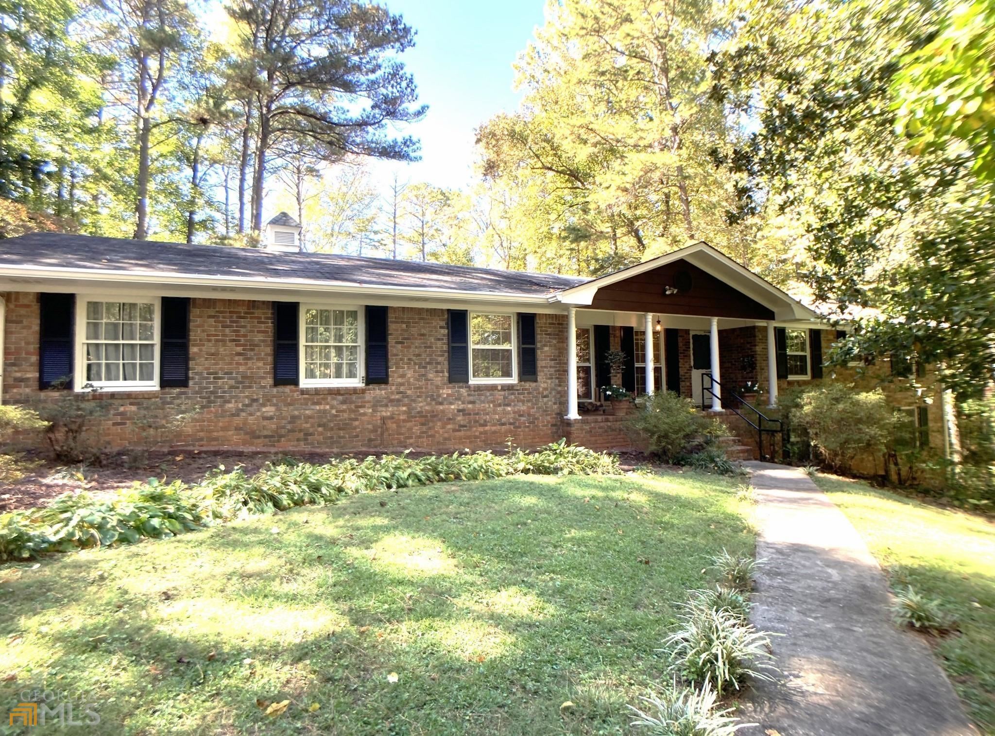 6620 White Mill Road Fairburn, GA 30213 - Photo 1 of 1 a front view of a house with a yard
